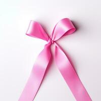 A pink ribbon on a white background. Breast Cancer Month. photo