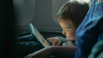 Little boy traveling in an airplane video