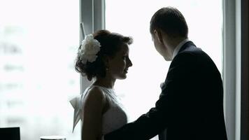 Bridal pair looking out the window video