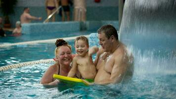 Grandparents and a grandson in the swimming pool video