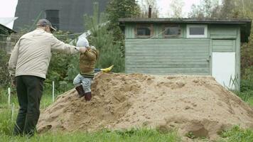 Grandfather and grandson outdoors video