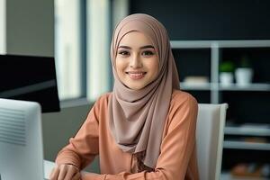 a Malay female employee sitting at her workplace in an office. AI Generated photo