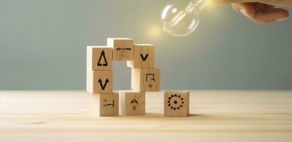 Creative idea, solution and innovation concept. Idea generation for business development. Wooden cube blocks with light bulb and cycle icons on clean background and copy space. AI Generative photo