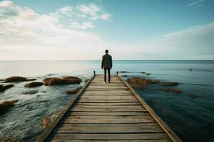 On the pier, he surveys the vastness of the ocean ahead AI Generated photo