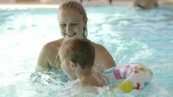 Little child having swimming lessons video