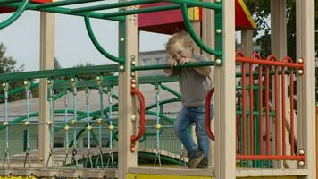 Boy on playground equipment video