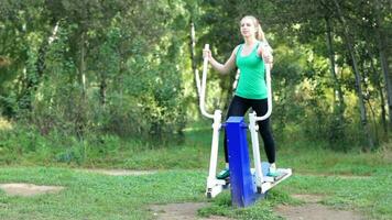 Woman exercising on a trainer video