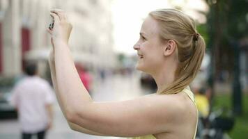 Woman taking a photo while sightseeing video