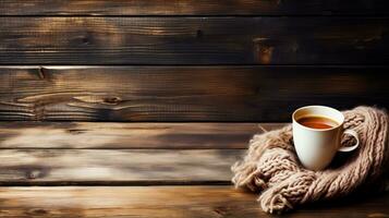 A rustic wooden table adorned with vintage knitted sweaters and mugs of steaming cocoa background with empty space for text photo