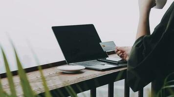 Young woman freelancer traveler working online using laptop and enjoying the beautiful nature landscape with mountain view at sunrise video