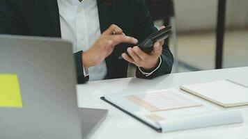 Financial analysts analyze business financial reports on a digital tablet planning investment project during a discussion at a meeting of corporate showing the results of their successful teamwork. video