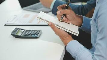 Financial analysts analyze business financial reports on a digital tablet planning investment project during a discussion at a meeting of corporate showing the results of their successful teamwork. video