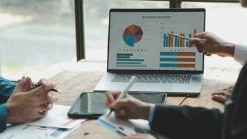 Teamwork with business people analysis cost graph on desk at meeting room. double exposure successful teamwork,business planning concept. video