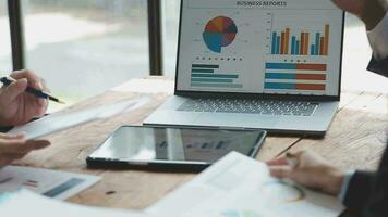 Teamwork with business people analysis cost graph on desk at meeting room. double exposure successful teamwork,business planning concept. video