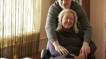 Thirty-year-old son hugs his mother looking to the camera video