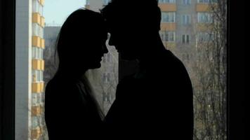 Two lovers embracing Silhouette video