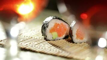 Sushi rolls and plum wine Beautiful shallow dof video