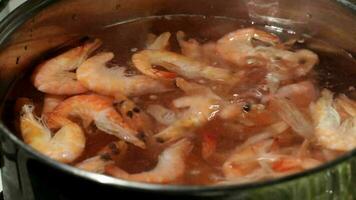 Shrimp are simmered in a saucepan video