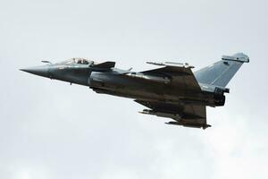 Military fighter jet plane at air base. Airport and airfield. Air force flight operation. Aviation and aircraft. Air defense. Military industry. Fly and flying. photo