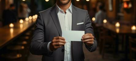 Businessman showing card photo