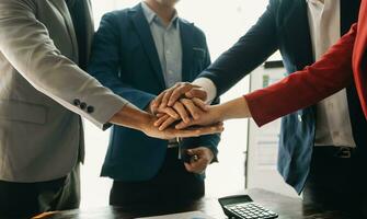 business people shaking hands during a meeting in office photo