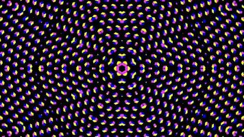 a circular pattern of dots in purple, pink and blue video