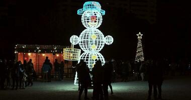 Led snowman christmas illuminations dark winter evening video