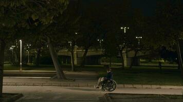 Evening outing of a handicapped child in empty park video