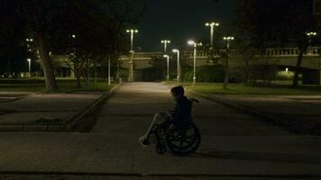 Lonely walk of a disabled kid in evening park video