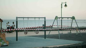 Empty playground with warning tapes. Coronavirus restrictions video