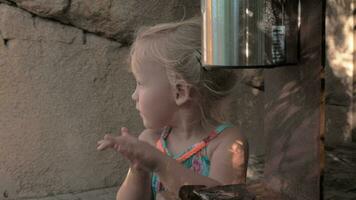 Little girl sanitizing hands outdoor video
