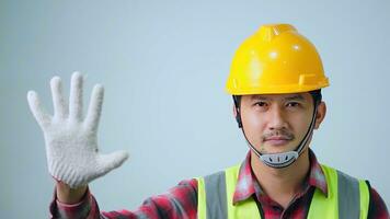 Asian fornman forbid and reject hardhat showing gesture to accept money white background. Architect, Engineer of Concept. photo