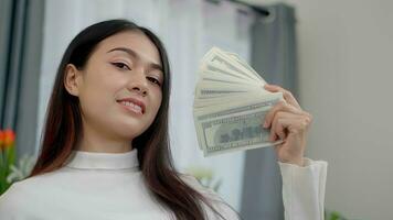 Asian freelance woman counting money in home. photo