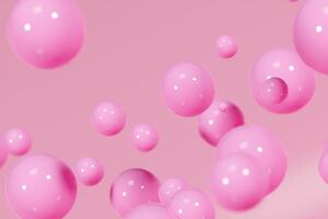 Pink shiny balls on peachy background photo