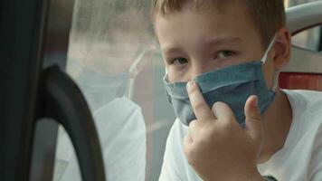 Child in mask showing middle finger as revolt video