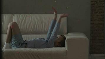 Playful child wants to catch laser dots of Christmas illumination video