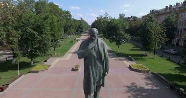 Aerial summer scene of Russian town with monument on tree-lined avenue video