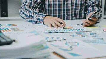 Team of business people working together in the meeting room office, teamwork background charts and graphs banner, double exposure successful teamwork,business planning concept. video
