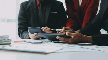 Team of business people working together in the meeting room office, teamwork background charts and graphs banner, double exposure successful teamwork,business planning concept. video