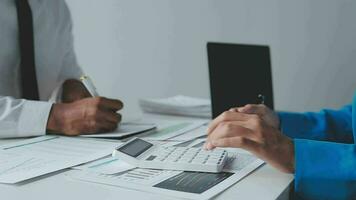 Audit concept,Administrator business man financial inspector and secretary making report calculating balance. Internal Revenue Service checking document. video