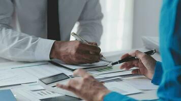 Audit concept,Administrator business man financial inspector and secretary making report calculating balance. Internal Revenue Service checking document. video
