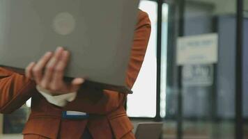 Entrepreneur Asian businessman and businesswoman discussing new business project in tablet in modern Meeting In Modern Office, Asian business casual concept. video