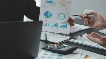 Close up of Business team analyzing income charts and graphs with modern laptop computer. Business analysis and strategy concept. video