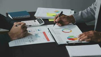 Close up of Business team analyzing income charts and graphs with modern laptop computer. Business analysis and strategy concept. video