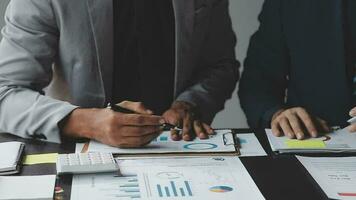 Close up of Business team analyzing income charts and graphs with modern laptop computer. Business analysis and strategy concept. video