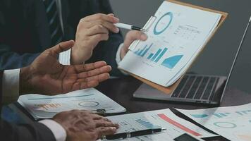 Close up of Business team analyzing income charts and graphs with modern laptop computer. Business analysis and strategy concept. video