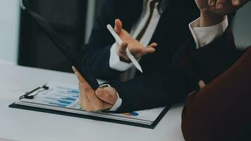 Team of business people working together in the meeting room office, teamwork background charts and graphs banner, double exposure successful teamwork,business planning concept. video