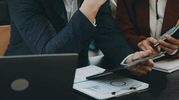 Team of business people working together in the meeting room office, teamwork background charts and graphs banner, double exposure successful teamwork,business planning concept. video