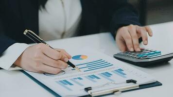 Team of business people working together in the meeting room office, teamwork background charts and graphs banner, double exposure successful teamwork,business planning concept. video