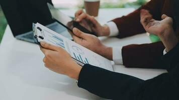Team of business people working together in the meeting room office, teamwork background charts and graphs banner, double exposure successful teamwork,business planning concept. video